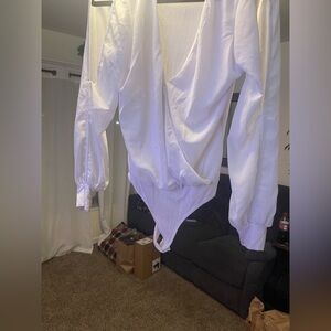 Women’s bodysuit low cut and sheer peek a boo sleeves